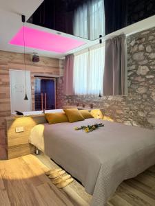 a bedroom with a large bed with flowers on it at Suite spa civico 4 in Follonica