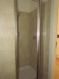 a shower with a glass door in a bathroom at Arco Michele in Putignano +59 photos