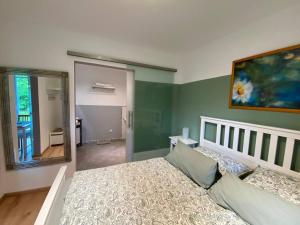 a bedroom with a bed and a large mirror at Wohnung am Rande der Nordheide in Welle