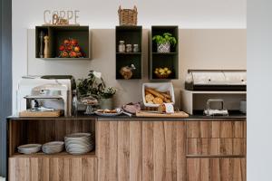 Køkken eller tekøkken på Hotel Catullo