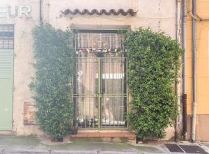 an entrance to a building with a gate at L'échappée in Collobrières