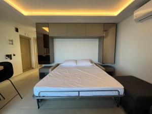 a bedroom with a large bed in a room at Latsis Suites in Plytra