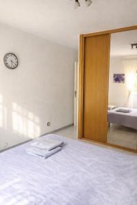 a bedroom with a large mirror and a bed at Rooms in Palma Center in Palma de Mallorca