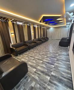 a waiting room with couches and chairs in a building at Hotel Shree Ji in Tālbahat