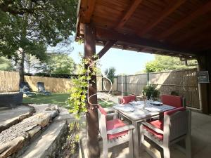 a table and chairs under a gazebo at La Petite Provence in Tourrettes