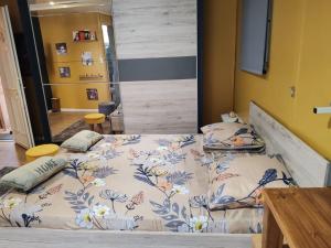 a bedroom with two beds in a room at Loc 'FCathy in Saint-Benoît
