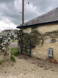 a building with a sign on the side of it at The Spinney, close to Silverstone in Brackley