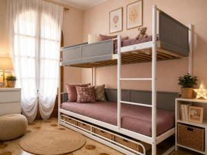 a bedroom with two bunk beds in a room at Torre Florio in Campofelice di Roccella