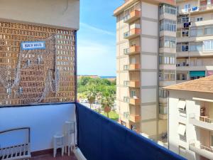 a balcony with a view of a building at Appartamento Miramare in Follonica