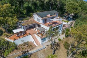 an overhead view of a large white house at Locus Solus Elba in Casa Marchetti +99 photos