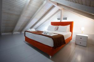 a bedroom with a large bed in a attic at Central Hotel in Parga +82 photos