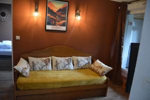 a bed with pillows on it in a room at Cauterets Mountain Nest in Cauterets +11 photos
