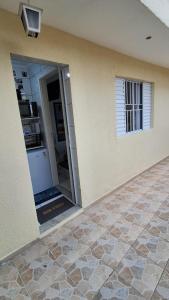 an open door to a kitchen in a house at Minicasa Show! in Jandira
