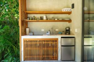 a kitchen with a sink and a counter at Serenity Bungalow in Cocles