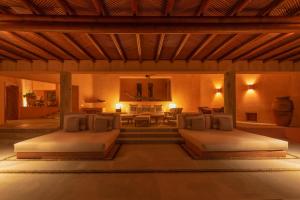 a bedroom with two beds in a room at Villa La Ceiba in La Huerta +47 photos