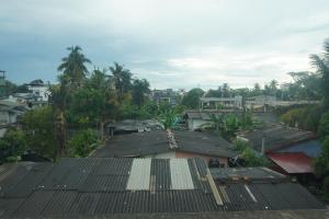 an overhead view of roofs of houses and trees at T-Nova Guest House in Trincomalee