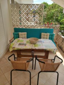 a table and chairs on a patio at Seaside villa in Eretria in Eretria