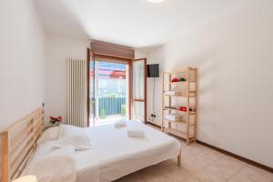 Posteľ alebo postele v izbe v ubytovaní Maranello Center