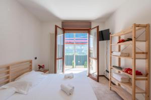 Posteľ alebo postele v izbe v ubytovaní Maranello Center