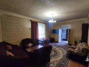 a living room with a couch and a table at Our Village in Ashtarak