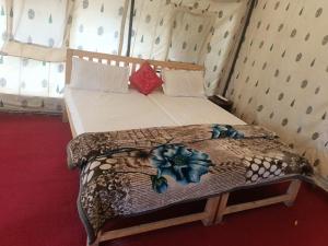 a bedroom with a bed in a room at Town Front Camping in Leh