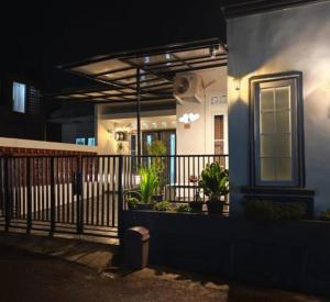 a night view of a porch of a house at Sukabumi Villa Mochi Private Jacuzzi in Sukabumi