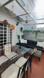 a living room with a couch and a table at PISO AURORA in Barbate +28 photos