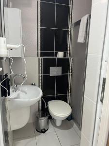 a small bathroom with a toilet and a sink at Caretta Vita Bella in Silifke