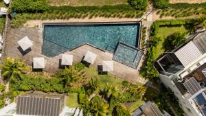 an overhead view of a swimming pool in a resort at Ocean Point B3 in Pointe aux Piments