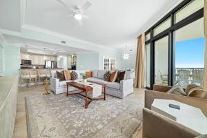 a living room with a couch and a table at The Oasis 805 in Orange Beach