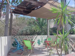 a group of chairs sitting on a patio at Sayu Life in Sayulita