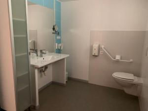 a bathroom with a toilet and a sink at Les chambres de Fred in Gorses +21 photos