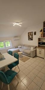a living room with a couch and a table at Žana in Kotor