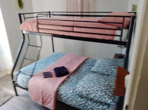 a couple of bunk beds in a room at Le café de la place in Saint-Germain-du-Teil +1 photo