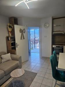 a living room with a couch and a table at Žana in Kotor