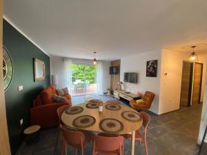a living room with a table and a couch at La Campagnarde in Pargny