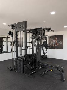 a gym with a large machine in a room at Smart Hotel GRU in Guarulhos