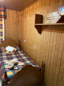 a bedroom with a bed with a stuffed animal on it at Apartamento Berro in Guadalaviar