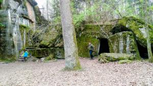 a man and a child standing in front of an old building at Apartament Mazury in Kętrzyn +2 photos