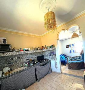 a kitchen with a counter with a stove top at Villa Rabia in Sidi Kaouki