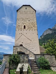 a large tower with stairs in front of a building at Ferienwohnung FeWe Wandern und Skifahren in Triesen