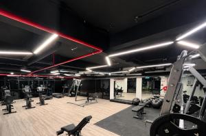 a gym with several treadmills and exercise equipment at Piccadilly Residence by LMS ipoh in Ipoh