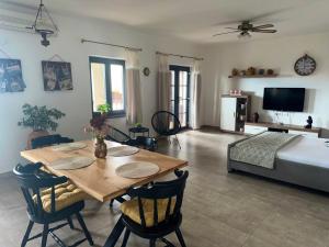 a living room with a table and a bed at Apartments Maro in Senj