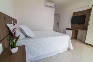 Postel nebo postele na pokoji v ubytování Itacolomi Hotel