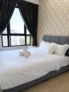 a large white bed with two pillows and a window at Piccadilly Residence by LMS ipoh in Ipoh +30 photos