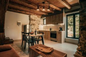 a kitchen with a table and chairs in a room at Ellafos Traditional Living-Elafonisi Couples Retreat in Elafonisi