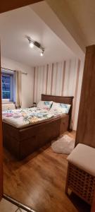 a bedroom with a large bed in a room at Gemütliche Ferienwohnung am Randes des Wendlands in Schnega