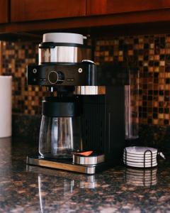 a coffee maker sitting on top of a counter at 3BR Modern Apt • Gym • Workspace • Quiet Location in Chicago +16 photos