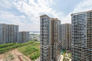an aerial view of a large city with tall buildings at Lucent Home in Gò Công
