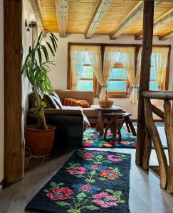 a living room with a couch and a table at ART Guest Home in Leshten